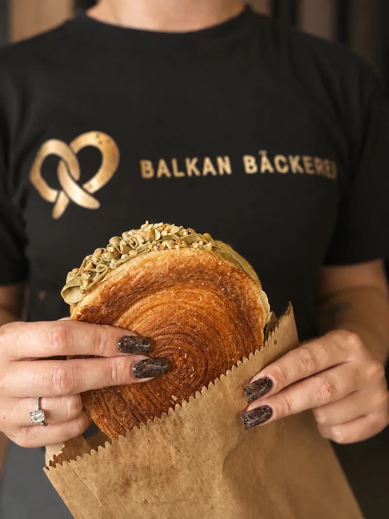 Balkan Bakery creator with fresh bread
